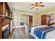 Spacious bedroom with fireplace, wood floors and barn door at 301 Old Hopewell Rd, Plant City, FL 33567