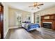 Bright bedroom featuring a ceiling fan and hardwood floors at 301 Old Hopewell Rd, Plant City, FL 33567
