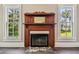 Elegant wood fireplace in a formal living space at 301 Old Hopewell Rd, Plant City, FL 33567
