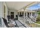 Large front porch with rocking chairs, offering curb appeal at 301 Old Hopewell Rd, Plant City, FL 33567