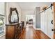 Long hallway with wood floors and access to bedrooms at 301 Old Hopewell Rd, Plant City, FL 33567