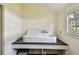 Old-fashioned laundry room with porcelain sink and granite countertop at 301 Old Hopewell Rd, Plant City, FL 33567