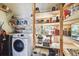 Laundry area with washer, dryer, and abundant shelving at 301 Old Hopewell Rd, Plant City, FL 33567