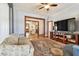 Cozy living room with hardwood floors, large TV, and comfortable seating at 301 Old Hopewell Rd, Plant City, FL 33567