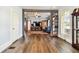 Open living room with hardwood floors and a view into other rooms at 301 Old Hopewell Rd, Plant City, FL 33567
