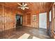 Bright sunroom with wood walls, wood floors, and barn door at 301 Old Hopewell Rd, Plant City, FL 33567