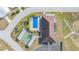 Community clubhouse with pool and shuffleboard at 35934 Verano Ln, Zephyrhills, FL 33541