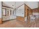 Dining area with built-in hutch and wood paneled walls at 35934 Verano Ln, Zephyrhills, FL 33541
