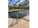 Residential inground pool with a screened enclosure at 404 13Th Sw St, Ruskin, FL 33570