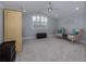 Charming bedroom with vaulted ceiling, large window, and two armchairs at 4709 Corsage Dr, Lutz, FL 33558