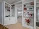 Spacious bedroom with built-in bookshelves and an ensuite bathroom at 4709 Corsage Dr, Lutz, FL 33558