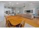 Open dining area with wood table and chairs, adjacent to kitchen at 4709 Corsage Dr, Lutz, FL 33558
