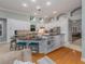 Open concept kitchen with island, granite counters & built-in shelving at 4709 Corsage Dr, Lutz, FL 33558