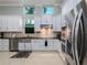 Updated kitchen featuring stainless steel appliances and white shaker cabinets at 4709 Corsage Dr, Lutz, FL 33558