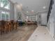 Open living area with hardwood floors, a fireplace, and ample natural light at 4709 Corsage Dr, Lutz, FL 33558