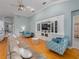 Spacious living room featuring hardwood floors, built-in shelving, and comfortable seating at 4709 Corsage Dr, Lutz, FL 33558