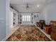 Spacious living room with built in shelving and a large patterned rug at 4709 Corsage Dr, Lutz, FL 33558