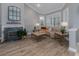 Cozy living room with a fireplace, large windows, and comfortable seating at 4709 Corsage Dr, Lutz, FL 33558