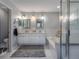 Double vanity bathroom with a large soaking tub and walk-in shower at 4709 Corsage Dr, Lutz, FL 33558
