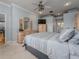 Main bedroom with carpeted floor, ceiling fan, and built-in wooden cabinets at 4709 Corsage Dr, Lutz, FL 33558