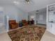 Relaxing sitting area with two leather armchairs and a patterned rug at 4709 Corsage Dr, Lutz, FL 33558