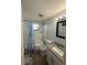 Bathroom with bathtub, shower, and granite countertop at 4841 Zodiac Ave, Holiday, FL 34690