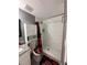 Clean bathroom with a shower/tub combo, white vanity, and stylish decor at 4841 Zodiac Ave, Holiday, FL 34690