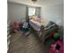 Bedroom with a silver sleigh bed, dresser, and rocking chair at 4841 Zodiac Ave, Holiday, FL 34690