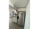 Stainless steel refrigerator and granite countertop island in a modern kitchen at 4841 Zodiac Ave, Holiday, FL 34690