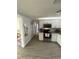 Modern kitchen with white shaker cabinets, granite countertops, and stainless steel appliances at 4841 Zodiac Ave, Holiday, FL 34690