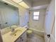 Clean bathroom with a bathtub, toilet and sink at 491 Allworthy St, Port Charlotte, FL 33954