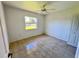 Simple bedroom with tiled floors and ceiling fan at 491 Allworthy St, Port Charlotte, FL 33954