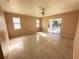 Bedroom with tile floors and sliding glass doors to the pool area at 491 Allworthy St, Port Charlotte, FL 33954