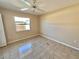 Simple bedroom with tile floors and a window at 491 Allworthy St, Port Charlotte, FL 33954