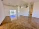 Spacious living room with tile floors and sliding doors leading to the pool at 491 Allworthy St, Port Charlotte, FL 33954