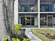Ground-level view of condo building with walkway at 4910 Bay Ne St # 103, St Petersburg, FL 33703