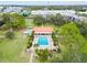 Community pool with lounge chairs and patio area at 4910 Bay Ne St # 103, St Petersburg, FL 33703