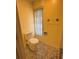 Small bathroom with toilet and shower at 10 Golfview S Rd, Rotonda West, FL 33947
