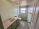 Bathroom with vanity and shower/tub combo at 10 Golfview S Rd, Rotonda West, FL 33947