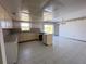 Kitchen with L-shaped island and view to dining area at 10 Golfview S Rd, Rotonda West, FL 33947