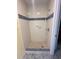Clean shower stall with blue tile trim at 10 Golfview S Rd, Rotonda West, FL 33947