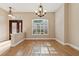 Elegant dining room with hardwood floors and chandelier at 10325 Millport Dr, Tampa, FL 33626