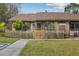 House exterior showcasing a brown roof and well-maintained landscaping at 106 Edgewood Ct, Oldsmar, FL 34677