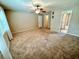 Large bedroom with ceiling fan and access to bathroom at 10908 W Elbow Dr, Tampa, FL 33612