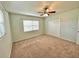 Bedroom with ceiling fan and window with blinds at 10908 W Elbow Dr, Tampa, FL 33612