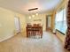 Dining area with tile flooring and a view to kitchen at 10908 W Elbow Dr, Tampa, FL 33612