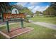 Babe Zaharias Golf Course entrance sign and paved pathway at 10908 W Elbow Dr, Tampa, FL 33612