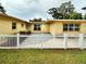 Side view of house showing patio and fence at 10908 W Elbow Dr, Tampa, FL 33612