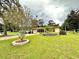 Front view of charming ranch home with landscaping at 10908 W Elbow Dr, Tampa, FL 33612