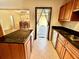 Kitchen with granite countertops, island, and access to backyard at 10908 W Elbow Dr, Tampa, FL 33612